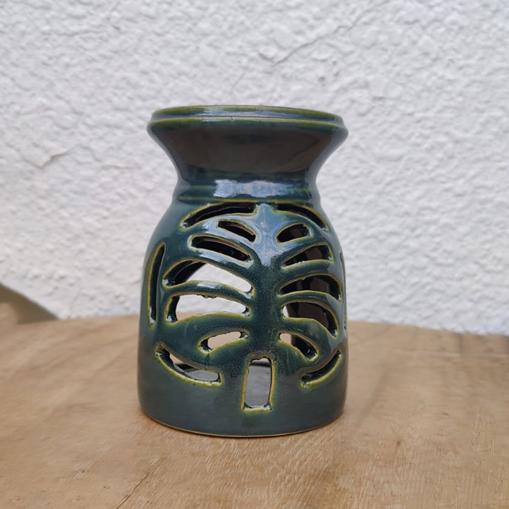 A handmade ceramic diffuser features a cutout motif of the iconic Palm Jumeirah.