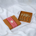 A Stainless Steel set of 4 - Palm Cheese knive set with a matte Brass finish. Sold as a set of 4 in a gift box.