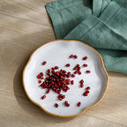 A set of four side plates made of a ceramic stoneware with contemporary curved edges, set off food beautifully.