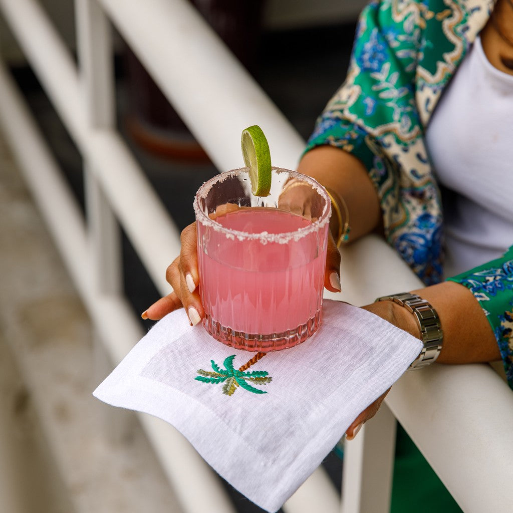 The intricate palm tree embroidery adds a touch of elegance to your table setting. Palm Cocktail Linen napkins.